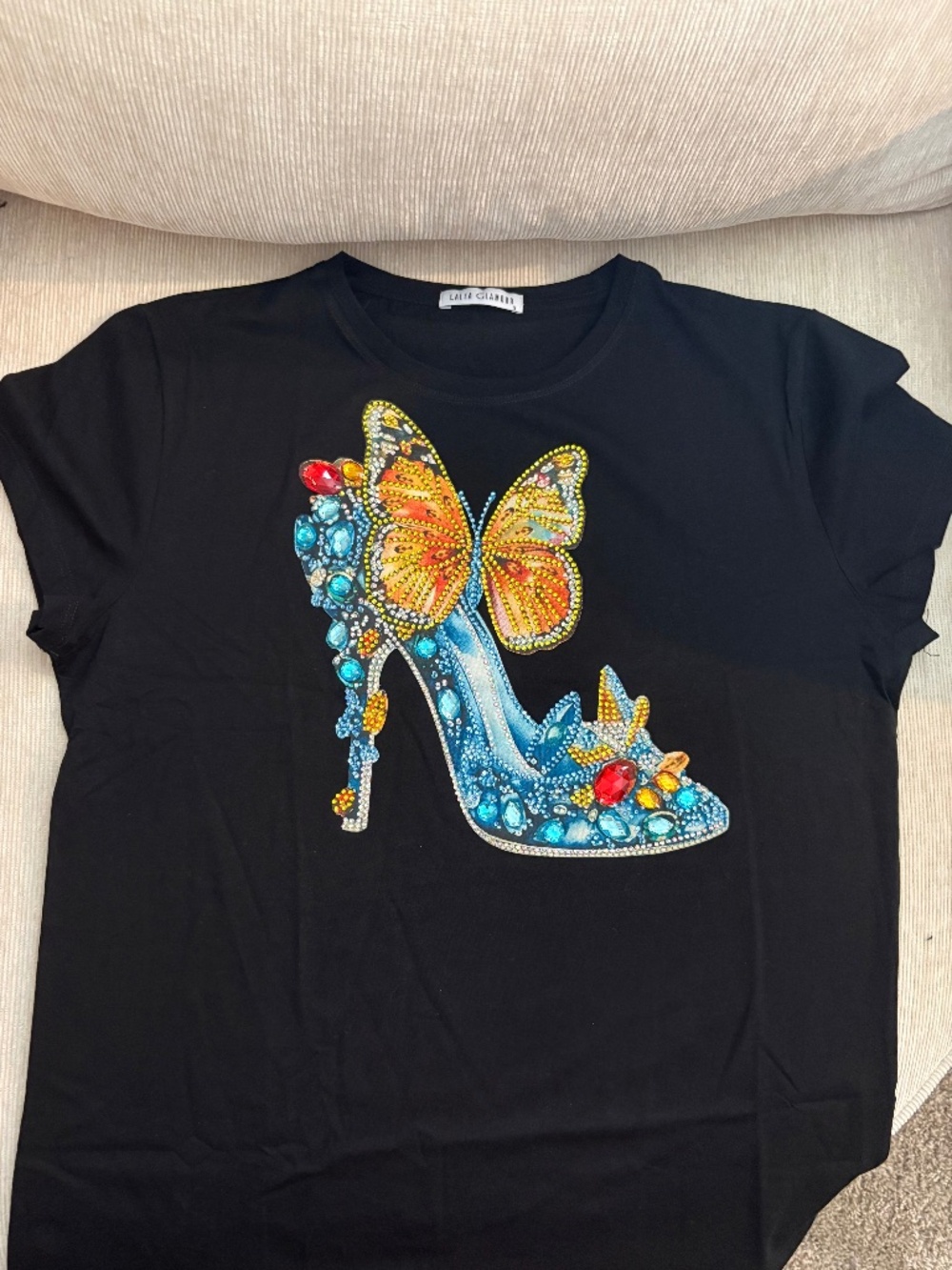 Cinderella vibe tee with beaded sandal and butterfly.